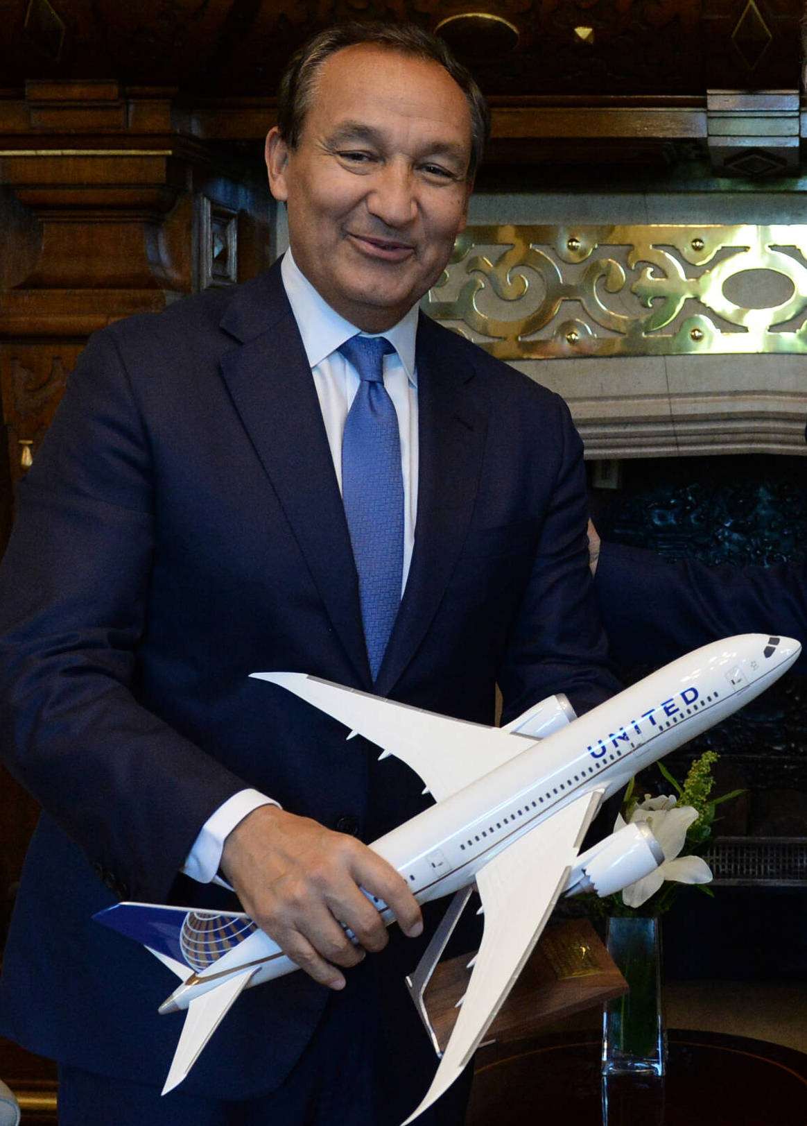 Photo of Oscar Munoz holding a toy United Airlines plane.