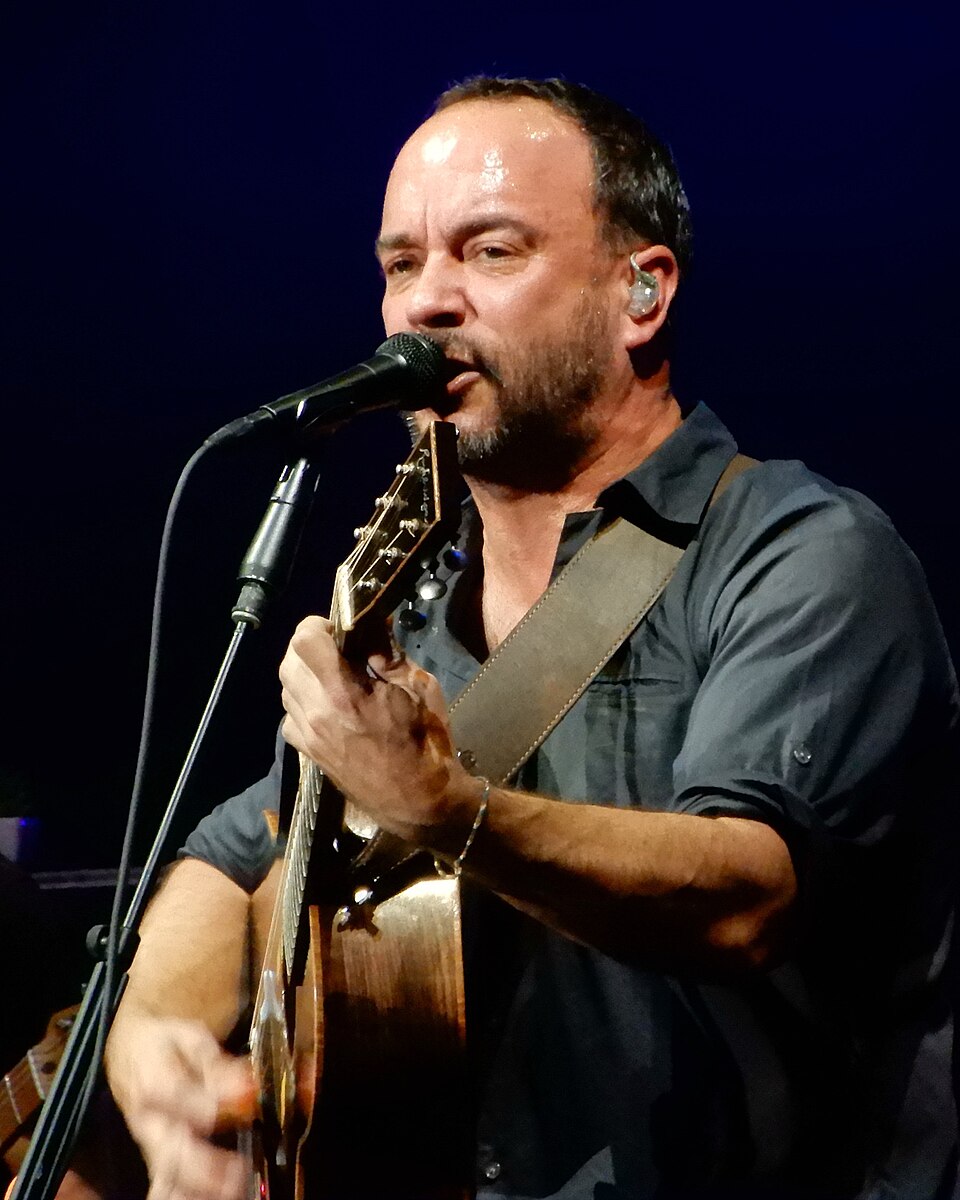 Photo of Dave Matthews playing the guitar